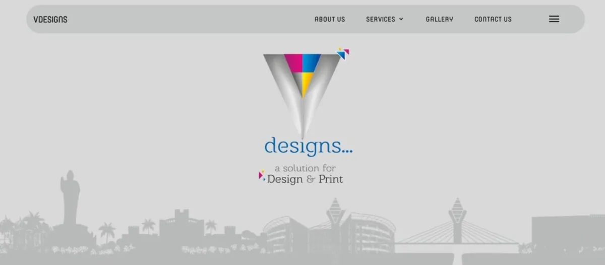 VDesigns home page with the V logo, the line a solution for design and print, and a Hyderabad skyline illustration